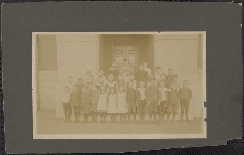 Students in front of Shattuck School with teacher