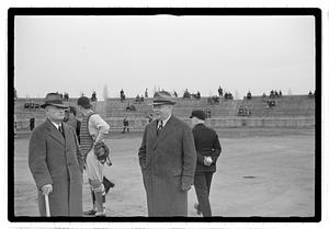 Boston Park Department Commissioner William Long speaking to another man