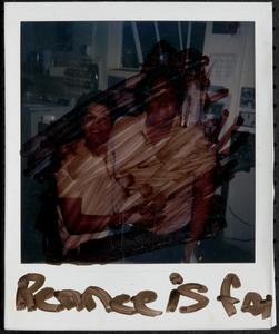 Two young people posing in the kitchen