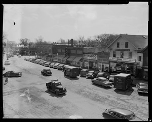 Overview of a commercial street featuring Danvers Meat Mart, Ropes Drugs, and Evergood among others