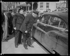 Officers inspecting a vehicle