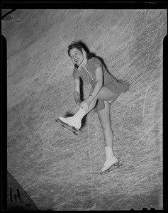 Sonja Henie lacing up her skate