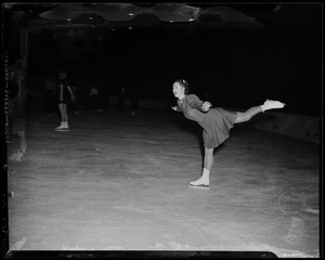 Sonja Henie skating with others on the ice