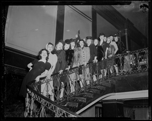 Women lined up on a staircase, including Sonja Henie