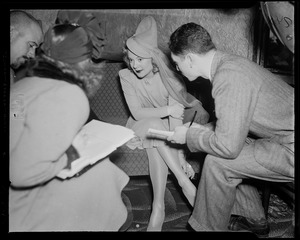 Sonja Henie with interviewers/reporters