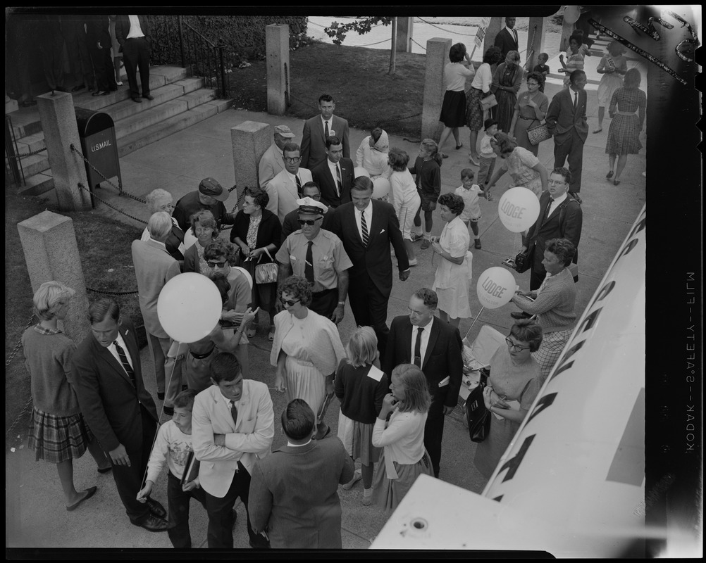 George C. Lodge walking through a crowd