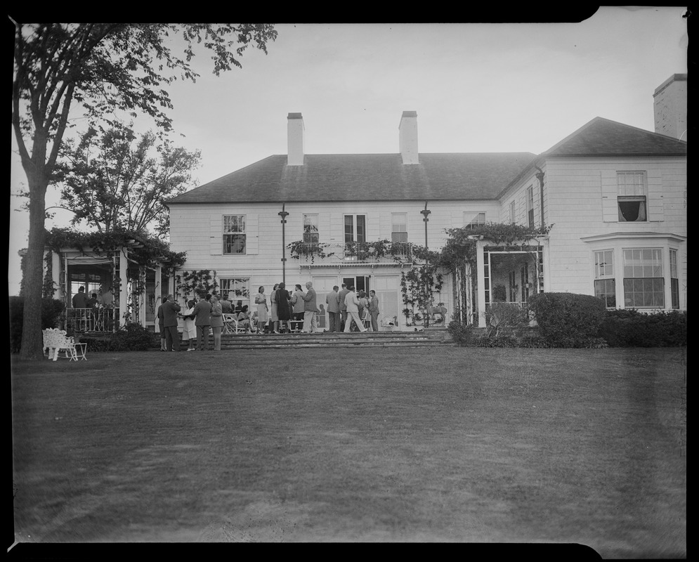 Group reception on the patio of a backyard garden