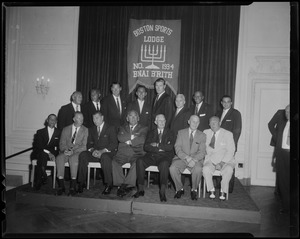 Group photo of the athletes honored at the seventh B'nai B'rith dinner at the Sheraton Plaza. Front (l. to r.): Eddie Arcaro (horse racing); Don Budge (tennis), Jack Dempsey (boxing), Ed "Strangler" Lewis (wrestling), Francis Ouimet (golf), Eddie Shore (hockey), Ty Cobb (baseball). Rear (l. to r.): Joe Linsey, president of the B'nai Brith Sports Lodge, Benny Friedman (football), Johnny Weissmuller (swimming), Bob Cousy (basketball), Chuck Connors (TV star), Willie Mosconi (billiards), Jessie Owens (track) and Sam Cohen, Past president of the Sports Lodge.