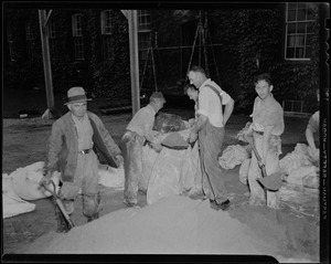 Group of men creating sandbags