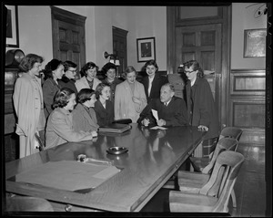 Suffolk Probate Court Judge Robert Gardiner Wilson seated at a table with a group of women around him