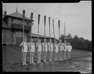 Group photo of 1914 Harvard Crew team on the dock during a reunion