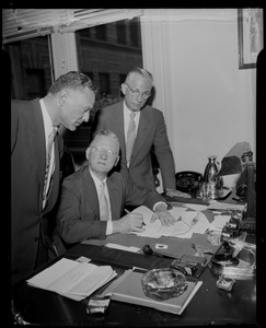 Atty. Joseph J. Gottleib, Mayor Hynes, and City Clerk Walter J. Malloy at the Mayor's desk for the land bill