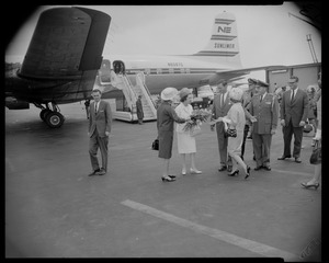 Mrs. Lyndon B. Johnson, wife of President, deplanes at Logan Airport following her flight from Washington D.C. and is welcomed by fans