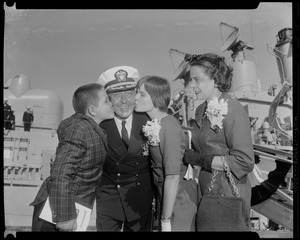 Missile ship skipper, Comdr. Munroe, is congratulated by his children, William R. III and Maria, and his wife, Carolota, at commissioning ceremonies