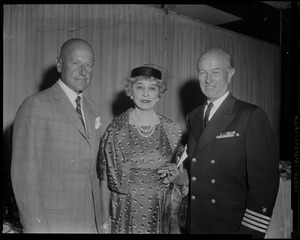 Officer with two guests of the Charles F. Adams missile ship commissioning