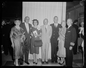 Comdr. Munroe and his wife, Carolota Supulveda Chapman, with a group of people featuring officers at the Charles F. Adams missile ship commissioning