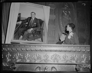 Marjorie and Marie Dever look at the portrait of former Governor Dever