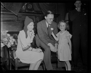 Princess Juliana and Prince Bernhard seated, with a young girl