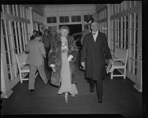 Governor and Mrs. Leverett Saltonstall walking in formal dress