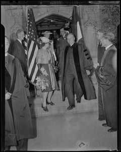Princess Juliana and another man in Harvard robe walking down stairs