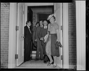 Princess Juliana and Prince Bernhard exiting a building with others