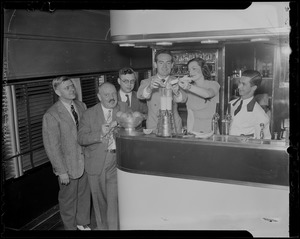 Fred Waring demonstrating a mixer with a group of people