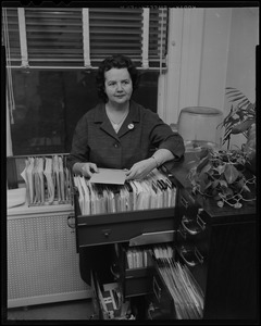 Louise Hicks at the filing cabinet