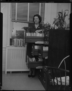 Louise Hicks at the filing cabinet