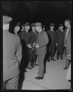 President Dwight Eisenhower shaking the hands of a police officer during a Boston visit