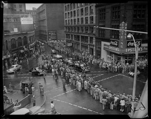 Intersection of a crowd watching the motorcade of President Dwight Eisenhower during his Boston visit