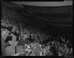 President Dwight Eisenhower at the podium, addressing the crowd