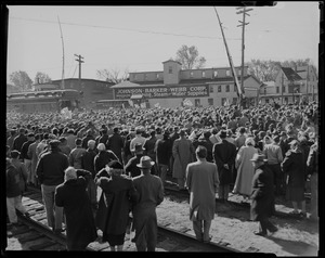 Crowd gathering outside train stop near Johnson Barker Webb Corp during a General Eisenhower visit