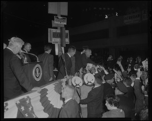 President Johnson leans down from Post Office Sq. platform where he addressed throng of 80,000 and shook hands