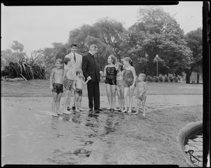 Prince Alexandre and Bishop Sheen with children in a park