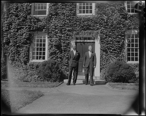 Leopold III and Nathan M. Pusey, President of Harvard University, standing outside of ivy covered building