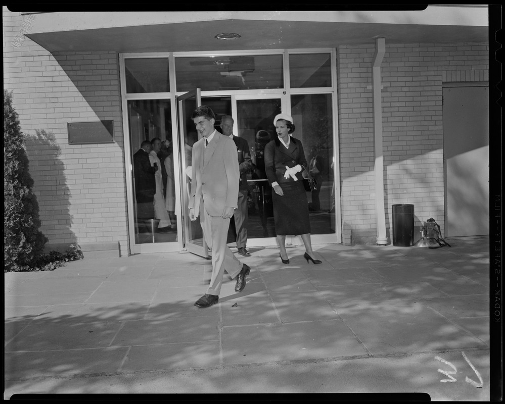 Prince Alexandre and mother Lilian, Princess of Réthy, walk out of building at Boston Children's Hospital