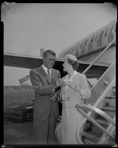 Cary Grant giving his autograph to stewardess Barbara Shephard