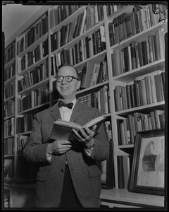 Arthur Schlesinger, Jr. standing, with book