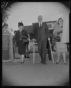 Mayor John F. Collins with his mother Mrs. Margaret Collins and wife Mary, walking