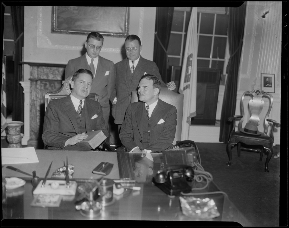 Governor of Massachusetts Robert F. Bradford sitting next to Governor ...