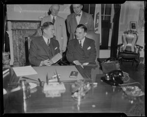 Governor of Massachusetts Robert F. Bradford sitting next to Governor of New York Thomas E. Dewey with two men standing behind them