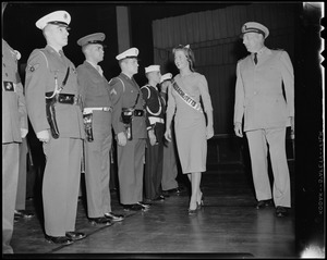 Pat Nordling walking next to a group of uniformed men