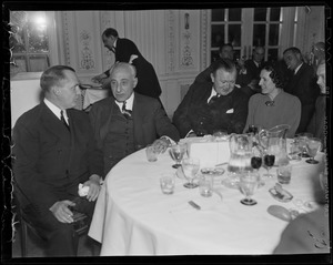 Ray McCarthy, Al Porcelein, Alfred Burns, and Miss Katherine McElhaney, members of the committee in charge of the testimonial dinner given for Edward R. Mitton of Jordan Marsh