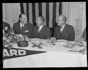 Richard A. Edwards, Jr., Burnelle Hawkins and one other man sitting at the head table at the testimonial dinner for Edward R. Mitton at the Copley Plaza