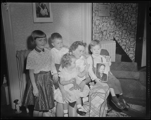 John F. Collins family: wife Mary Patricia and four children, Thomas, Patricia, John, Jr., and Peggy, posing with his photograph