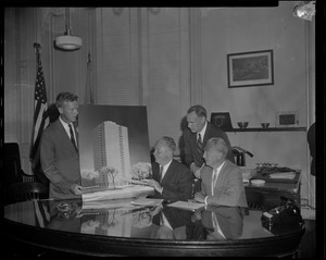 William F. Furlog shows Mayor Collins, Ernest Henderson, and D.C. Cave a rendering of the apartment to be constructed in the Roxbury Redevelopment Area