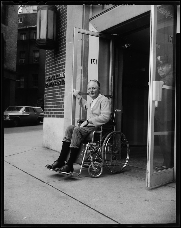 Mayor Collins exiting the doors of New England Hospital after being stricken with respiratory ailments