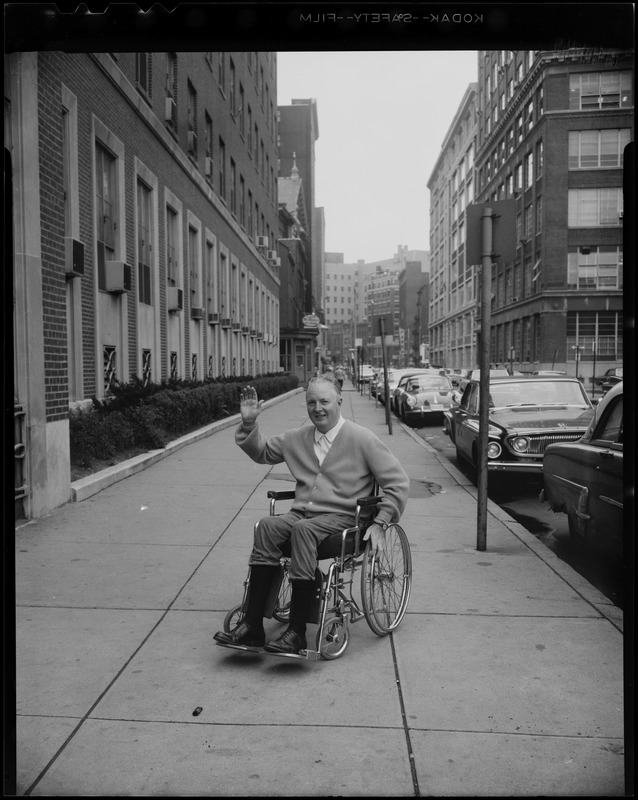 Mayor Collins waving from the sidewalk outside of New England Hospital after being stricken with respiratory ailments