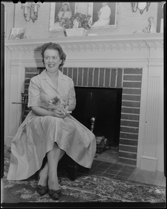 Mary Collins in front of the fireplace