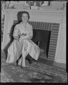 Mary Collins in front of the fireplace